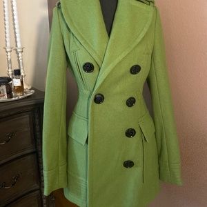Green coat with beautiful black buttons Details.